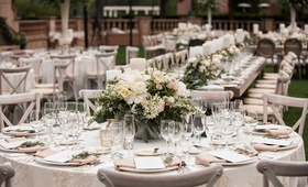 Low Arrangements of Cream Flowers
Photography: Triple Cord Photography
Read More:
http://www.insideweddings.com/weddings/destination-wedding-with-outdoor-reception-lavish-after-party/982/ Outdoor wedding reception round table with low centerpiece peony ranunculus greenery rustic elegant