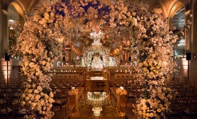 Lush Floral Arches Over Mirror Aisle
Photography: Ira Lippke Studios
Read More:
http://www.insideweddings.com/weddings/opulent-destination-wedding-at-a-luxury-hotel-in-new-york-city/1004/ The Plaza Hotel wedding ceremony flower arches over mirror aisle opulent ceremony decor