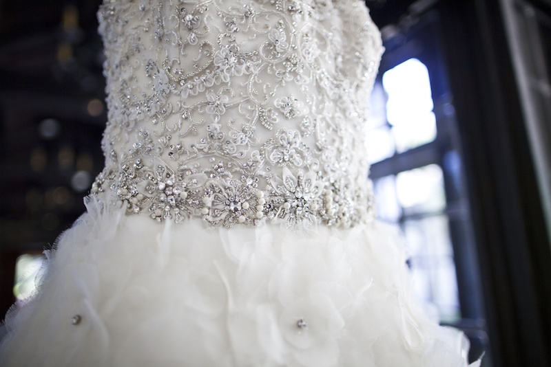 Ornate Dress Bodice
Photography: Images by Berit, Inc.
Read More:
http://www.insideweddings.com/weddings/wedding-with-purple-modern-details-at-a-chateau-in-new-jersey/693/ Lazaro wedding dress with bodice covered in beading, crystals, sequins, ruffled skirt with crystals