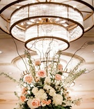 Flower Arrangement Under Light Fixture
Photography: Wendy Wilson Photography
Read More:
http://www.insideweddings.com/weddings/romantic-rooftop-ceremony-ballroom-reception-in-new-orleans/991/ centerpiece with garden roses, hydrangeas, ranunculus, eucalyptus stems and seeded eucalyptus
