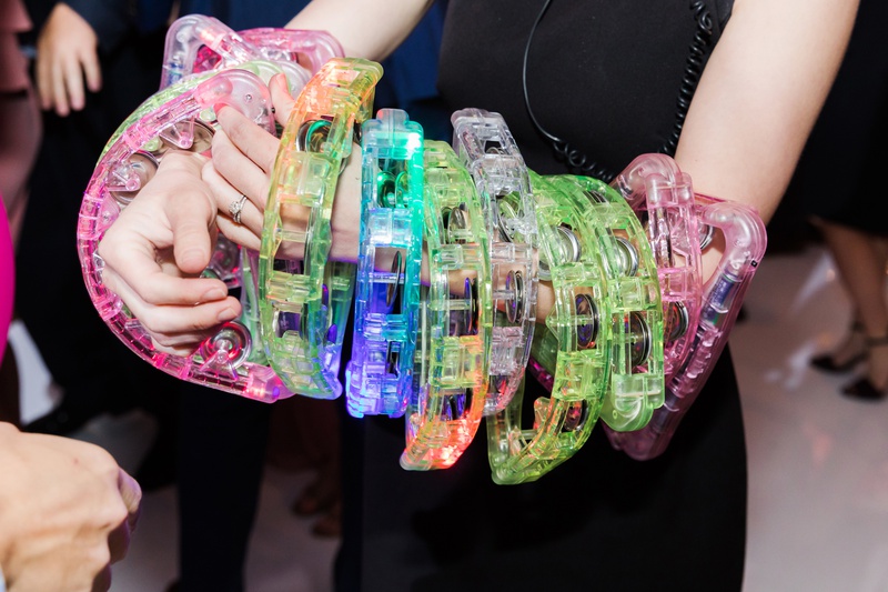 Colorful Tambourines
Photography: Perez Photography
Read More:
http://www.insideweddings.com/weddings/church-ceremony-classic-country-club-reception-with-pink-palette/1284/ colorful plastic tambourines on dance floor during wedding reception