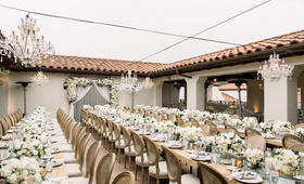 Santa Barbara Open-Air Reception
Photography: Brett Hickman Photographers
Read More:
http://www.insideweddings.com/weddings/taylour-rutledge-and-shane-vereen/1276/ outdoor wedding reception bacara long wood tables with low centerpieces crystal chandelier overhead