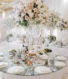 Centerpieces of Roses
Photography: Rene Zadori Photography
Read More:
http://www.insideweddings.com/weddings/opulent-wedding-with-classic-winter-white-color-scheme/1233/ wedding centerpiece on glass vessel with ivory and blush roses