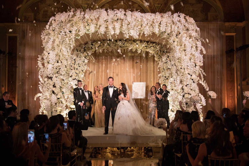 Lush Chuppah with Orchids at Ceremony
Photography: The Day by Ira Lippke
Read More:
http://www.insideweddings.com/weddings/opulent-luxury-wedding-with-timeless-color-palette-in-new-york-city/1199/ jewish wedding ceremony mirror aisle flower petal confetti toss orchid chuppah