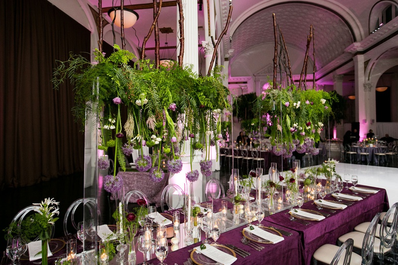 "Floating" Garden Centerpiece
Photography: Callaway Gable
Read More:
http://www.insideweddings.com/weddings/modern-in-the-round-ceremony-whimsical-garden-inspired-reception/1155/ Vibiana wedding reception purple linens clear acrylic chairs greenery orbs candles