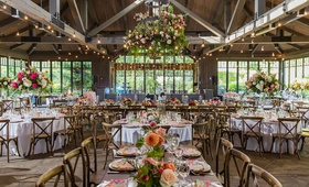 Colorful Rustic Wedding Reception
Photography: Vue Photography
Read More:
http://www.insideweddings.com/weddings/southern-labor-day-weekend-wedding-with-vibrant-color-palette/1342/ wedding reception wood beams twinkle lights flower chandelier pink orange flowers wood chairs
