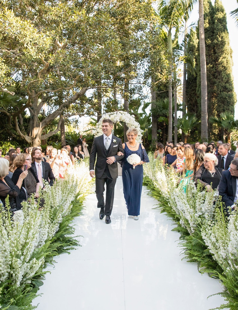 Groom with Mother in Navy Gown
Photography: Duke Photography
Read More:
http://www.insideweddings.com/weddings/luxurious-alfresco-ceremony-ballroom-reception-in-beverly-hills/1161/ Mother's attire mother of groom in navy blue dress open shoulder detail white bouquet guests flowers