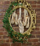 Framed Pointe Shoes
Photography: Kesha Lambert Photography
Read More:
http://www.insideweddings.com/weddings/adorable-flower-girls-in-a-ballet-inspired-styled-shoot/1000/ ornate gold frame with ivy framing ballet pointe shoes