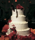 Buttercream Wedding Cake
Photography: KingenSmith
Read More:
http://www.insideweddings.com/weddings/sophisticated-fall-wedding-at-the-peninsula-chicago/216/ Simple four layer confection with fall flowers