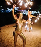 Fire Dancers on the Beach
Photography: Branco Prata
Read More:
http://www.insideweddings.com/weddings/luxe-destination-wedding-with-view-of-aegean-sea-in-mykonos-greece/1372/ destination wedding in mykonos greece fire dancers painted gold on beach entertainment performers