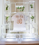 Ice Sculpture with Groom's Jersey Inside
Photography: McCune Photography
Read More:
http://www.insideweddings.com/weddings/stephanie-ming-and-levine-toilolo/1067/ Wedding reception decor ice sculpture with white roses inside and white gold jersey Levine Toilolo