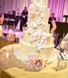 Five-Tier Cake with Cascading Petals
Photography: KingenSmith
Read More:
http://www.insideweddings.com/weddings/modern-wedding-with-soft-color-palette-and-personalized-details/792/ five-tier buttercream wedding cake with cascading petals