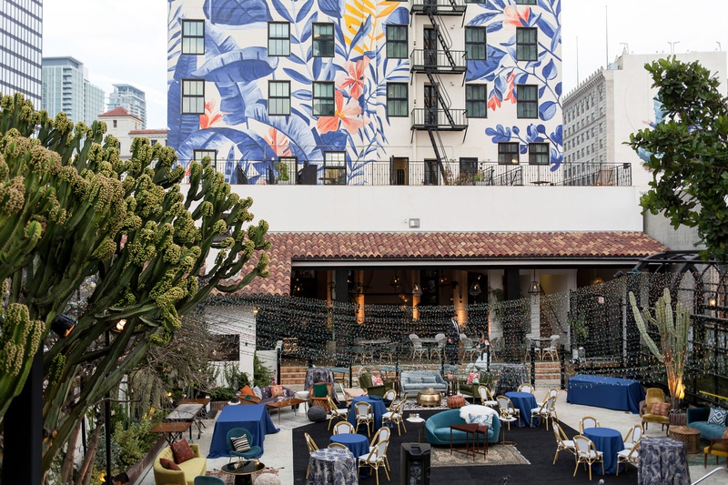 Alfresco Reception Lounge in LA
Photography: Maya Myers Photography
Read More:
http://www.insideweddings.com/weddings/candlelit-jewish-ceremony-unique-cozy-outdoor-reception-in-la/1346/ wedding reception lounge area outdoor hotel figueroa mural on back of building backdrop tropical