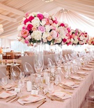 Tall Centerpieces at Large Head Table
Photography: Kortnee Kate Photography
Read More:
http://www.insideweddings.com/weddings/outdoor-wedding-glamorous-tented-reception-with-pastel-palette/1318/ wedding reception tent venue blush linen on long head table ghost chair tall pink white centerpiece