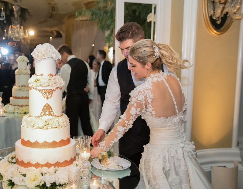 Bride %26 Groom Cutting into Rose Gold Cake
Photography: Duke Photography
Read More:
http://www.insideweddings.com/weddings/luxurious-alfresco-ceremony-ballroom-reception-in-beverly-hills/1161/ Bride in marchesa couture wedding dress groom in vest cutting wedding cake white rose gold flowers