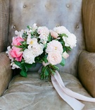 Ribbon-Tied Pink Bouquet
Photography: Lane Dittoe Photography
Read More:
http://www.insideweddings.com/weddings/romantic-garden-party-inspired-summer-wedding-at-a-country-club/967/ Green stems tied with pink ribbon pink peony ranunculus garden rose and bay leaf leather chair