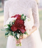 Fall-Hued Bouquet for Chapel Wedding
Photography: Eric Kelley
Read More:
http://www.insideweddings.com/weddings/chapel-ceremony-tented-reception-in-the-south-carolina-lowcountry/1057/ Bride carrying burgundy peony and white peony flower bouquet for wedding lace top and skirt dress