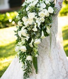 Dramatic Cascading Ivory Bouquet
Photography: Chris Bailey Photography
Read More:
http://www.insideweddings.com/weddings/southern-at-home-wedding-inspired-by-father-of-the-bride-in-texas/753/ Bride in Isabelle Armstrong wedding dress holding cascading bouquet of green leaves, white flowers
