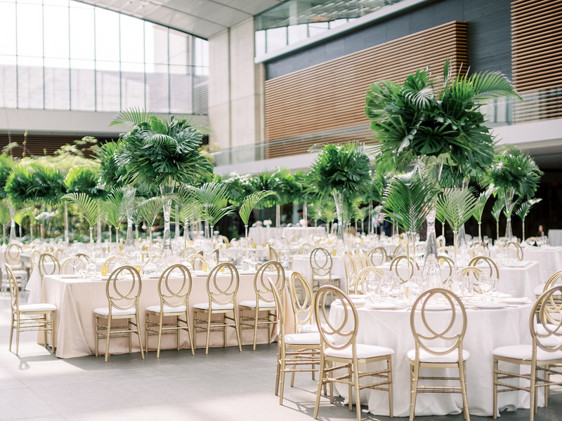 Gold Oval-Back Reception Chairs
Photography: Lauren Gabrielle Photography
Read More:
http://www.insideweddings.com/weddings/summer-real-wedding-featuring-tropical-decor-at-an-art-museum/1328/ cleveland museum of art wedding reception tropical greenery heatherlily gold chairs modern look