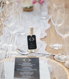 Lace Table Runner %26 Tequila Escort Card
Photography: Sara Richardson Photography
Read More:
http://www.insideweddings.com/weddings/wags-barbie-blank-hockey-player-sheldon-sourays-mexico-wedding/964/ Wedding reception Barbie Blank and Sheldon Souray mini tequila bottle escort cards matching menu