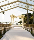 Clear-Tented Outdoor Ceremony
Photography: Alain Martinez Photography
Read More:
http://www.insideweddings.com/weddings/opulent-luxury-wedding-with-white-gold-color-scheme-in-palm-beach/1375/ wedding ceremony the mar a lago club view of palm trees white flowers gold chairs