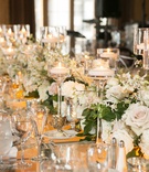 Floating Candles in Glass Pedestals
Photography: L Photographie
Read More:
http://www.insideweddings.com/weddings/church-ceremony-elegant-reception-with-silver-details/1127/ runner of flowers and floating candles in glass pedestals
