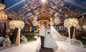 Couple Kissing in Ceremony Tent
Photography: Curtis Dahl Photography
Read More:
http://www.insideweddings.com/weddings/luxury-wedding-with-an-art-deco-theme-in-southern-california/1122/ Wedding ceremony tent original runner company aisle runner clear tent flower chandelier twilight