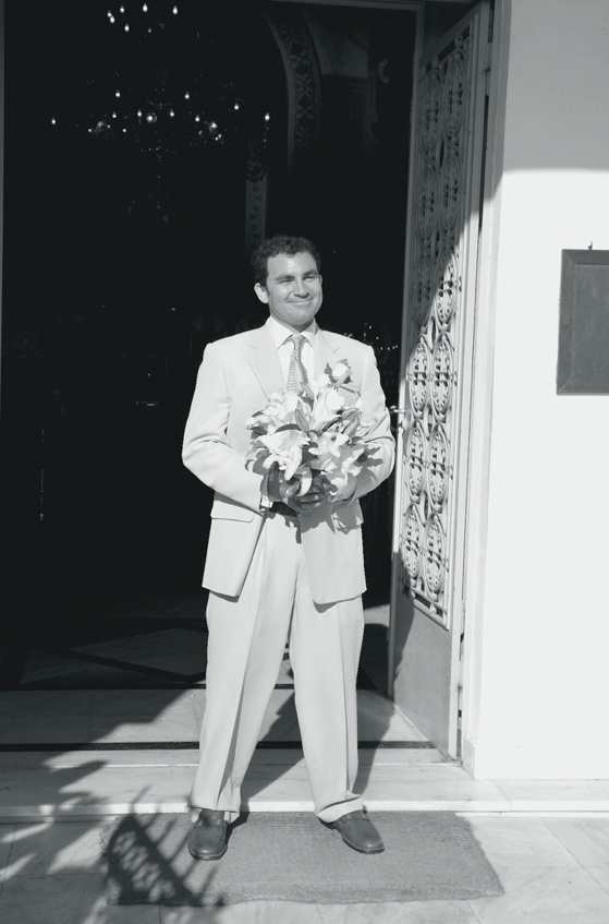 Groom Holding Bouquet
Photography: Mark Nixon Photographer
Read More:
http://www.insideweddings.com/weddings/destination-wedding-on-the-greek-island-of-santorini/207/ Black and white photo of groom with flowers