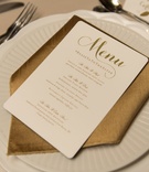 Reception Menu with Hashtag
Photography: Green Vintage Photography
Read More:
http://www.insideweddings.com/weddings/modern-country-club-wedding-with-baseball-inspired-details/1043/ ivory wedding menu with gold lettering, clever wedding hashtag on menu