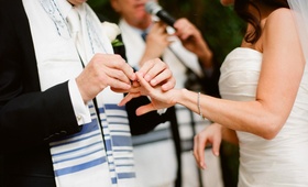 Bride and Groom
Photography: Elizabeth Messina
Read More:
http://www.insideweddings.com/weddings/timeless-all-white-wedding-in-beverly-hills-california/295/ Groom places ring on bride in a Pronovias strapless gown at an outdoor Jewish ceremony