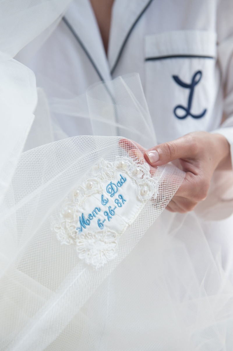 Mother's Wedding Dress Embroidered
Photography: John Solano Photography
Read More:
http://www.insideweddings.com/weddings/an-opulent-garden-ceremony-ballroom-reception-in-beverly-hills/986/ Bride monique lhuillier wedding dress mom's wedding dress sewed into tulle of dress with blue