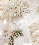 Indoor Trees Full of Cherry Blossoms
Photography: Rene Zadori Photography
Read More:
http://www.insideweddings.com/weddings/opulent-wedding-with-classic-winter-white-color-scheme/1233/ white indoor tree with globe candles and full white cherry blossoms.