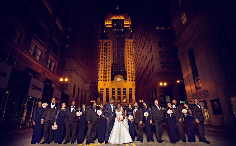 Black Tie Wedding Party in Chicago
Photography: Carasco Photography
Read More:
http://www.insideweddings.com/weddings/church-ceremony-with-nigerian-traditions-chic-ballroom-reception/845/ Bride and groom in navy tuxedo with bridesmaids in blue dresses and groomsmen in tuxes in Chicago