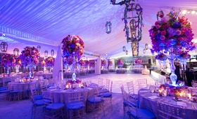 Purple %26 Pink Reception Lighting
Photography: Fred Marcus Studio
Read More:
http://www.insideweddings.com/weddings/pink-purple-garden-inspired-tented-wedding-in-new-york/624/ Tented wedding reception with purple and pink lighting and purple and pink flowers
