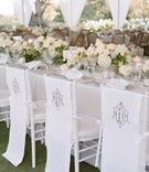 Monogram Chair Covers
Photography: Yvette Roman
Read More:
http://www.insideweddings.com/weddings/a-classic-wedding-with-rustic-touches-at-a-villa-in-santa-barbara/674/ White linen chair covers with wedding monogram
