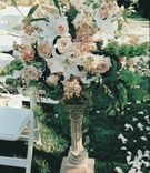 Tall Ceremony Arrangements
Photography: Isabel Lawrence Photographers
Read More:
http://www.insideweddings.com/weddings/romantic-seaside-wedding-at-the-biltmore-in-santa-barbara/76/ White ceremony chairs and aisleway flowers