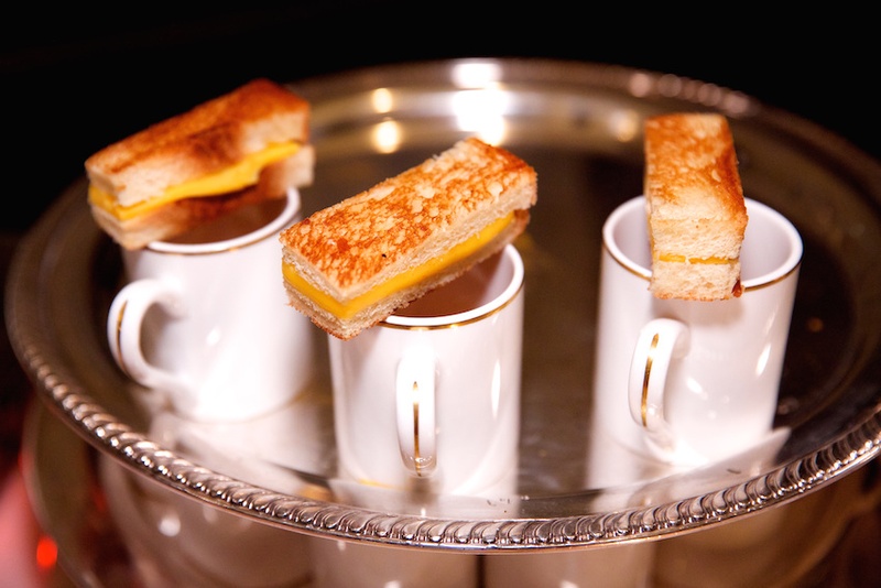 Grilled Cheese Sandwich Appetizers
Photography: Bob %26 Dawn Davis Photography
Read More:
http://www.insideweddings.com/weddings/glamorous-ivory-blush-spring-wedding-at-a-private-club-in-chicago/685/ Wedding cocktail hour grilled cheese sandwiches & tomato soup in small china cups on silver tray
