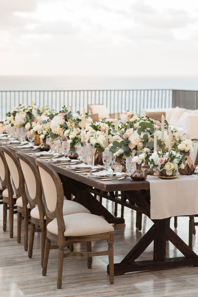 Romantic Reception at Modern Resort
Photography: Collin Pierson Photography
Read More:
http://www.insideweddings.com/weddings/beach-wedding-ceremony-romantic-reception-inspiration-in-cabo/1304/ wedding reception on rooftop outdoors cabo mexico wood table round back french chair low centerpiece