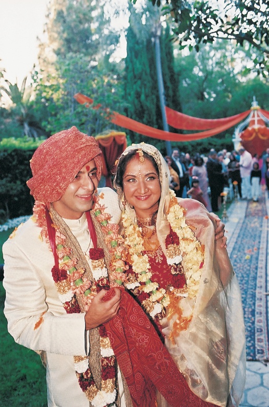 Newlyweds at Indian Ceremony
Photography: Simone %26 Martin Photography
Read More:
http://www.insideweddings.com/weddings/indian-wedding-at-the-beverly-hills-hotel-california/9/ Bride and groom in traditional Indian wedding attire