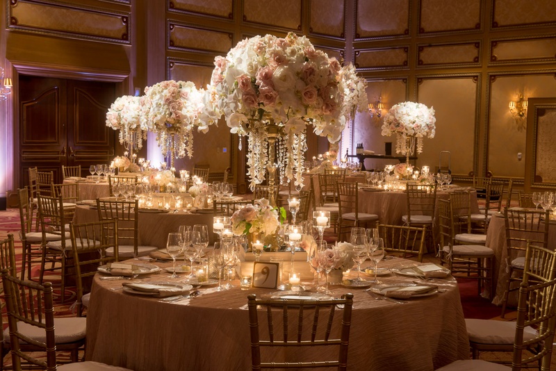 Rose and Orchid Centerpieces on Reception Tables
Photography: Boyd Harris Photographs
Read More:
http://www.insideweddings.com/weddings/a-jeweled-floral-wedding-at-fairmont-grand-del-mar-in-san-diego/745/ Wedding reception tables with rose and orchid centerpieces dripping with jewels