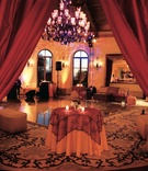 Morocco-Inspired Reception Entryway
Photography: Handeland Tesoro Photography
Read More:
http://www.insideweddings.com/weddings/old-world-inspired-wedding-in-california/163/ Red linens and dance floor with large chandelier