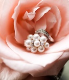 Pearl %26 Diamond Ring
Photography: Nancy Cohn Photography
Read More:
http://www.insideweddings.com/weddings/florida-sunset-inspired-wedding-at-the-breakers-palm-beach/391/ White pearl and diamond ring on pink rose