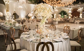 Fairy-Tale Reception Décor
Photography: Duke Photography
Read More:
http://www.insideweddings.com/weddings/luxurious-alfresco-ceremony-ballroom-reception-in-beverly-hills/1161/ wedding reception white rose gold round table mirror top dance floor chandelier beverly hills hotel