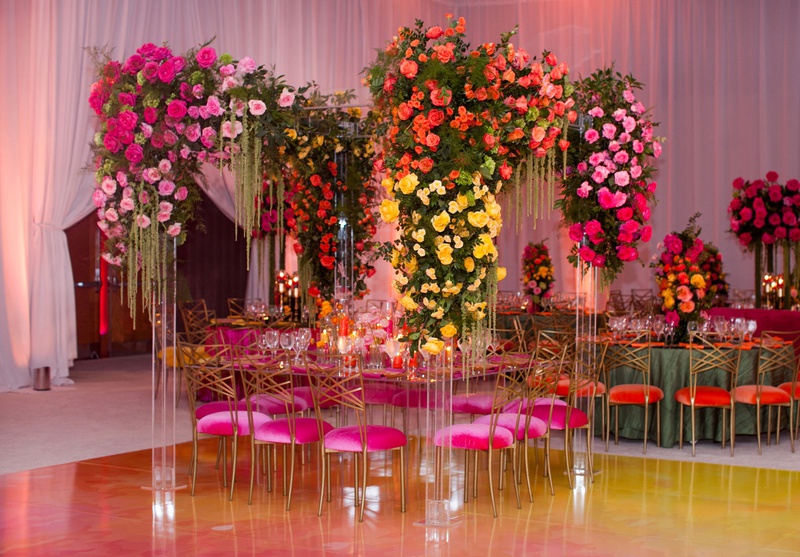 Lucite Arbor Over Reception Table
Photography: Clane Gessel Photography
Read More:
http://www.insideweddings.com/weddings/colorful-city-view-wedding-featuring-indian-and-japanese-traditions/1353/ wedding reception pink velvet cushion with yellow orange pink flowers lucite arch arbor ballroom