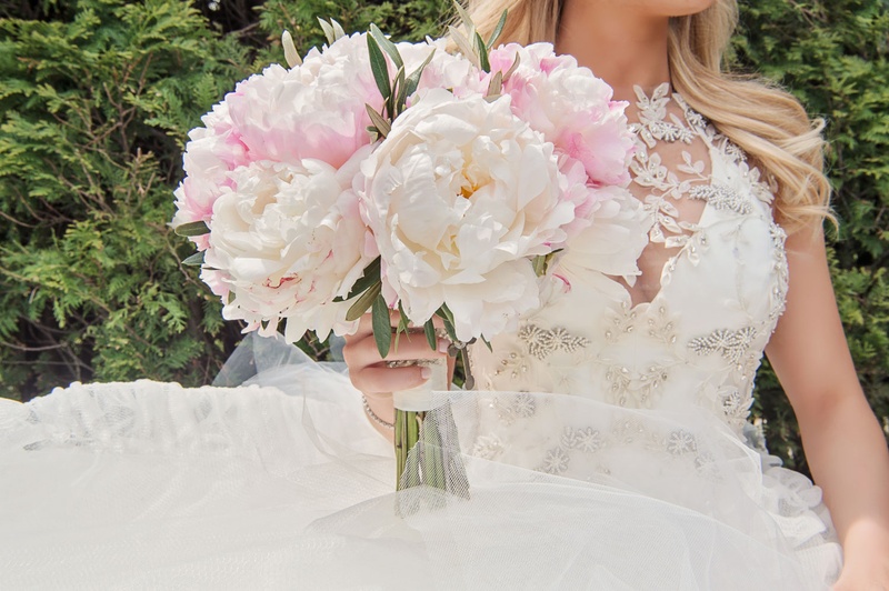 Peony Bouquet with "Something Old" Rosary
Photography: Carasco Photography
Read More:
http://www.insideweddings.com/weddings/traditional-ceremony-glamorous-garden-inspired-tented-reception/943/ Bride in Vera Wang dress holding pink peony bouquet with rosary of grandmother wrapped around stems