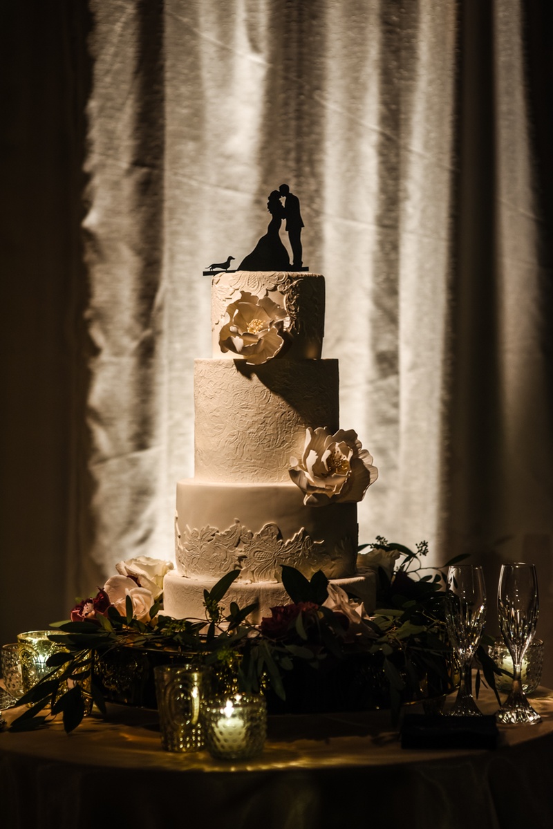 Wedding Cake with Silhouette Topper
Photography: Joe Photo
Read More:
http://www.insideweddings.com/weddings/the-unique-and-intimate-wedding-of-trains-bassist-hector-maldonado/879/ four tiered wedding cake bridal gown lace pattern pale gold sugar flowers silhouette cake topper