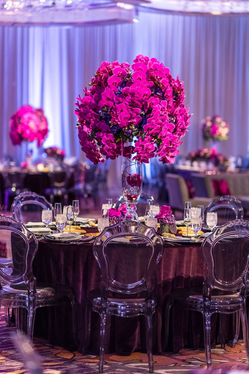 Tall Fuchsia Centerpiece
Photography: Brian Leahy Photography
Read More:
http://www.insideweddings.com/weddings/a-hawaiian-couples-luxurious-destination-wedding-in-las-vegas/1226/ translucent smoke grey chairs, velvet eggplant linens, fuchsia orchids tall centerpieces
