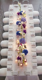 Aerial View of Table
Photography: Bob %26 Dawn Davis Photography
Read More:
http://www.insideweddings.com/weddings/modern-purple-blue-white-wedding-at-contemporary-chicago-venue/541/ Bird's eye view of long white reception table