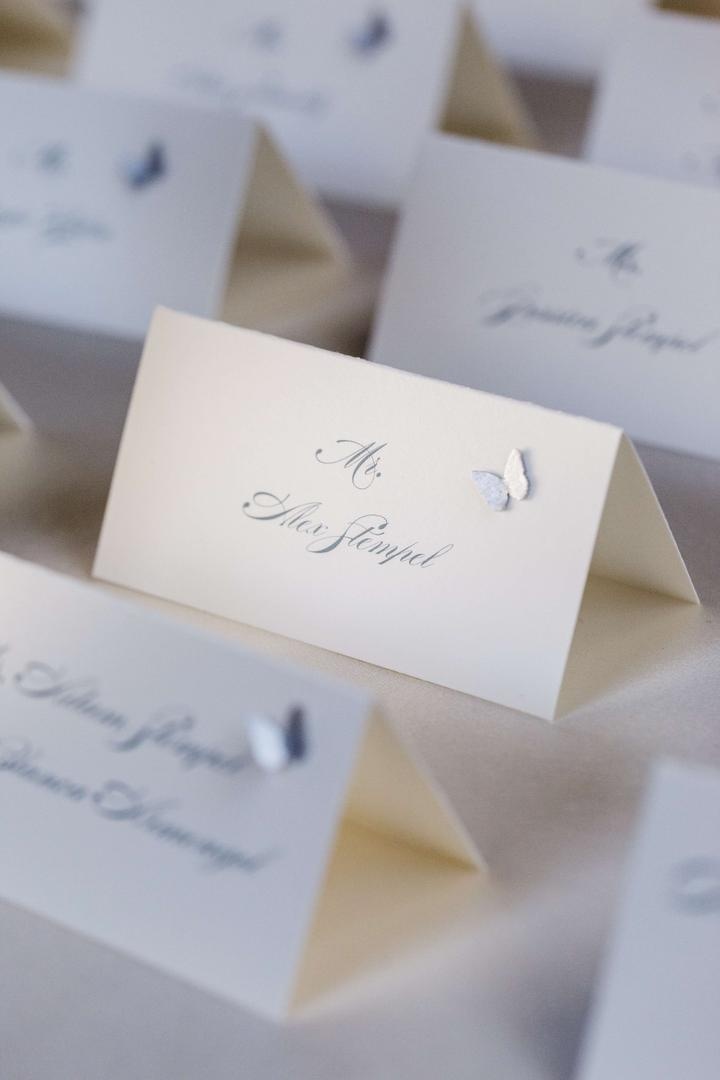 Butterfly Escort Cards
Photography: Chrisman Studios
Read More:
http://www.insideweddings.com/weddings/gorgeous-alfresco-garden-wedding-in-bel-air-california/436/ White seating card with grey lettering and applique