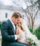 College Sweethearts at Wedding
Photography: Harwell Photography
Read More:
http://www.insideweddings.com/weddings/traditional-church-ceremony-luxury-ballroom-reception-in-atlanta/1096/ Bride in Berta wedding dress cascading white greenery bouquet groom in suit with bow tie cuddle